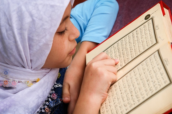 Girl Reading The Quran