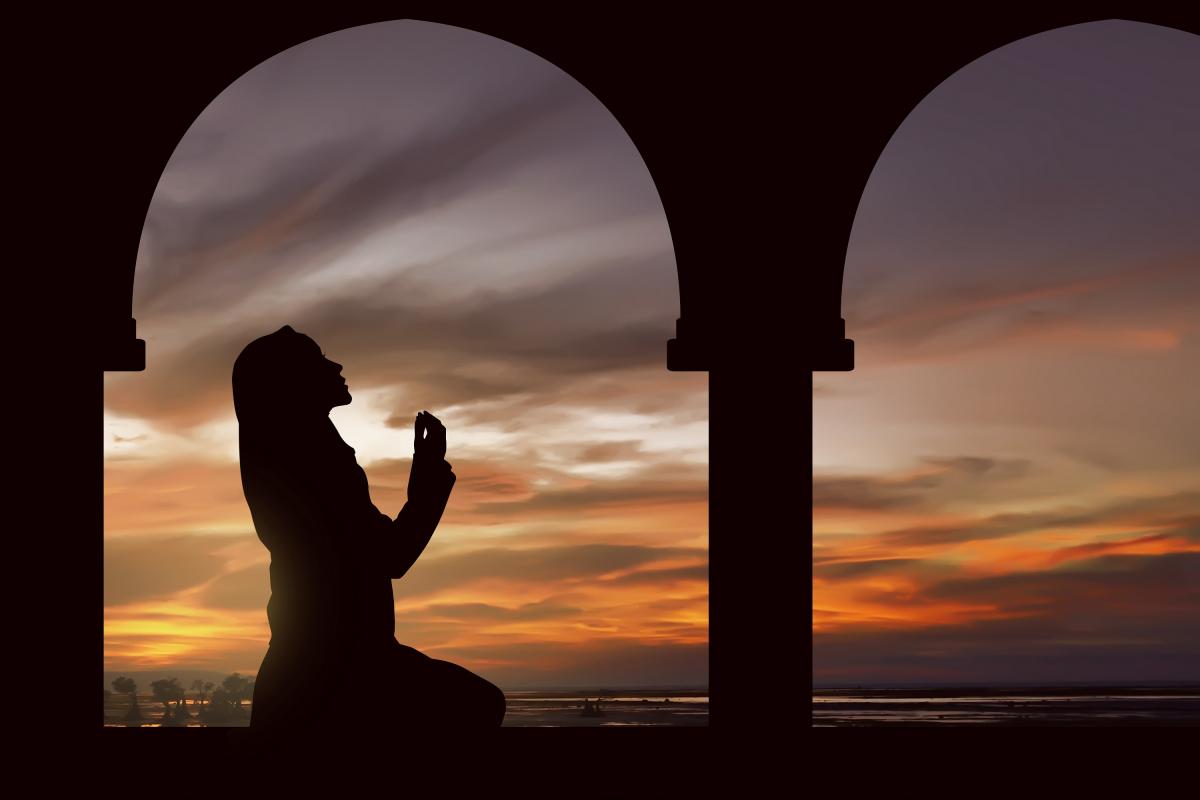 a girl praying at night with her hands visible