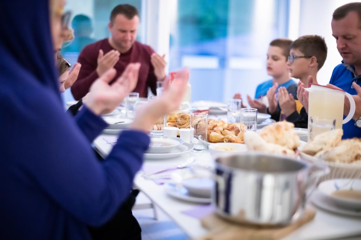 Family with Iftar dishes sitting