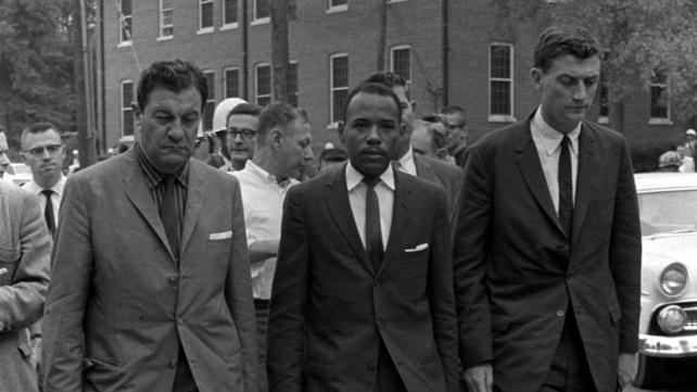 James Meredith  at University of Mississippi, accompanied by U.S. marshals.