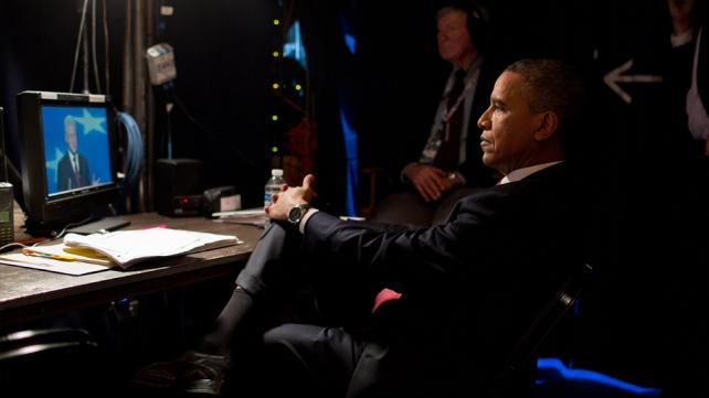 At the Democratic National Convention Barack Obama watches Bill Clinton nominating Obama for re-election as President.