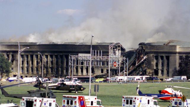 Smoke and flames rise over the Pentagon at about 10 a.m. EST on Sep. 11, 2001