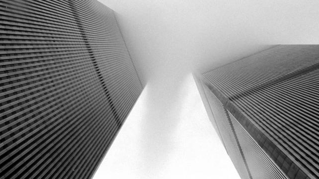 A cloud passes between the two towers of the World Trade Center.