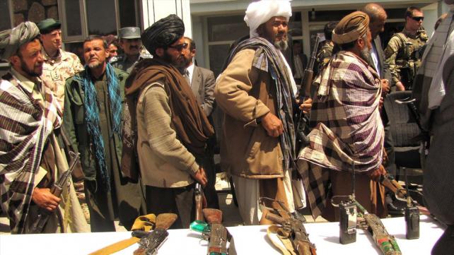 Former Taliban fighters line up to handover their Rifles to the Government of the Islamic Republic of Afghanistan 