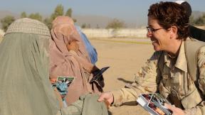 Kandahar, Afghanistan Sgt Tanya Casey, a volunteer from the Camp Nathan Smith, greets an Afghan woman during the celebration of Eid al-Adha 